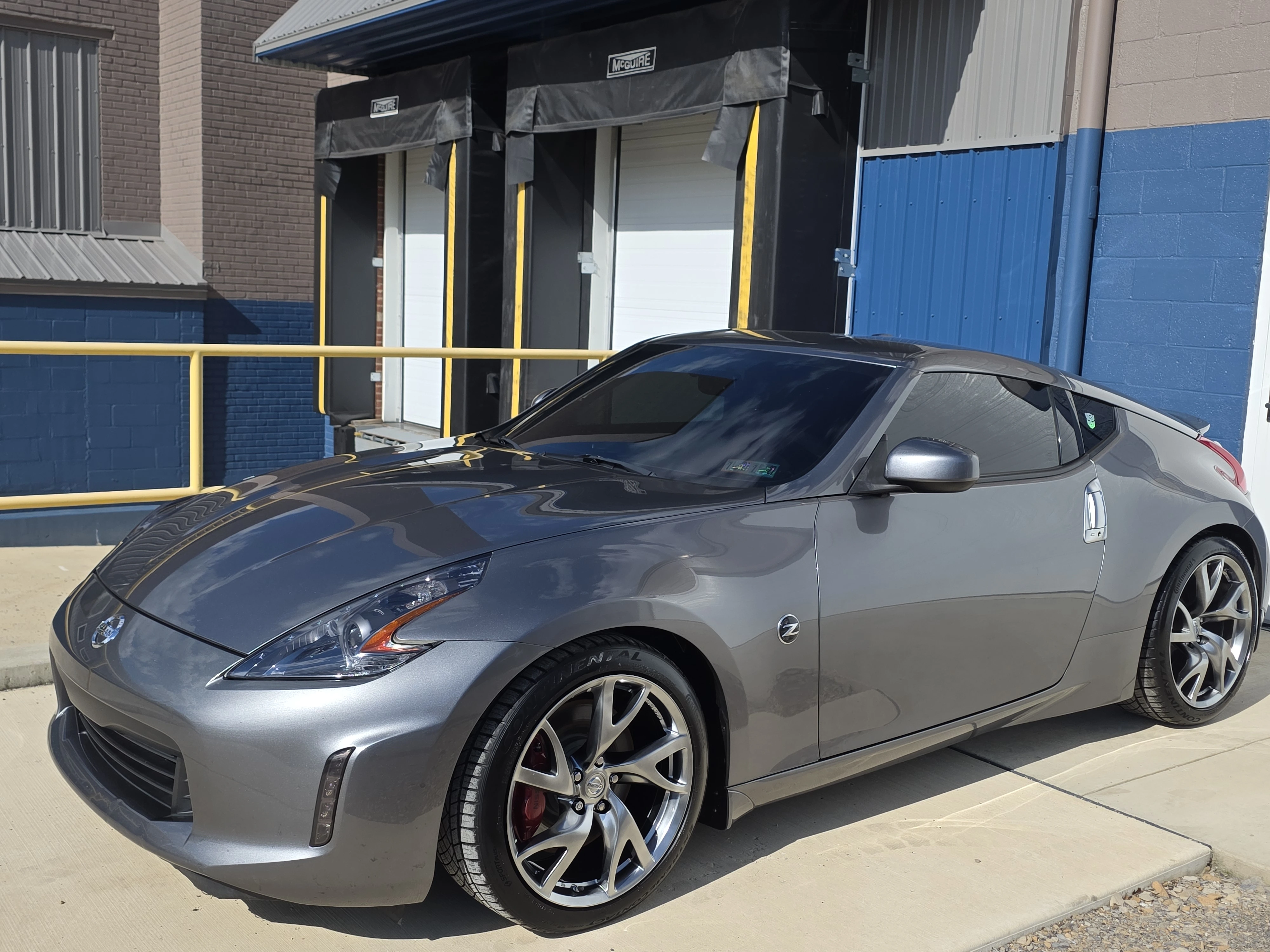 Ceramic coating applied to car paint delivering deep mirror reflection